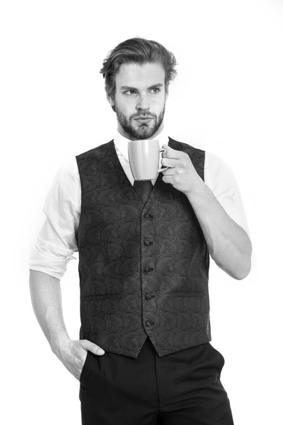 bearded man, serious gentleman drink tea or coffee from cup - Фото, изображение