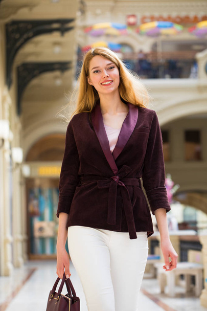 Young beautiful blonde woman in a corduroy jacket  - Zdjęcie, obraz