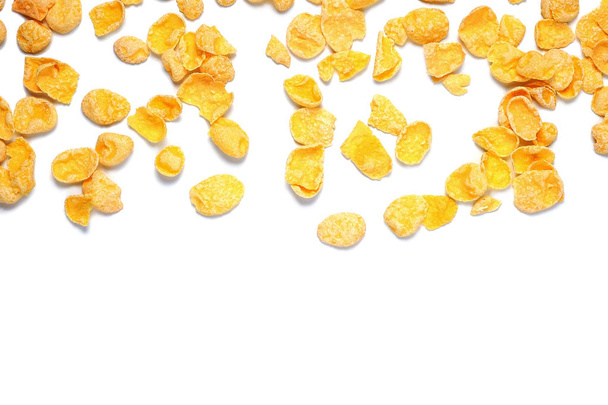 Scattered cornflakes isolated on white. Top view. - Photo, image