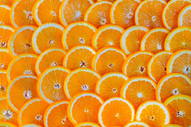 nahtloser abstrakter Hintergrund geschnittener Orangen.. - Foto, Bild