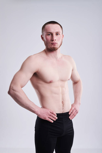 young man with strong naked torso - Fotó, kép