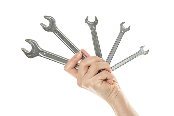 Набір вінтажних гайкових ключів у жіночій руці ізольовано на білому тлі
 - Фото, зображення
