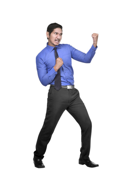 Young asian businessman with fighting stance posing isolated over white background - Φωτογραφία, εικόνα