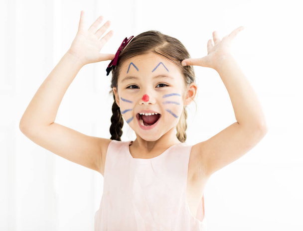 Adorable little girl with kitty painted face - Foto, immagini