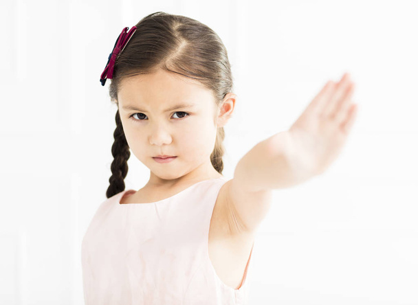 angry little girl showing stop sign - 写真・画像