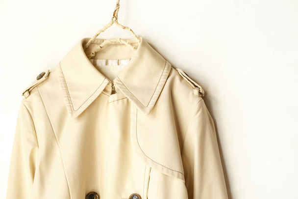 Beige elegant trench coat isolated over white - Φωτογραφία, εικόνα