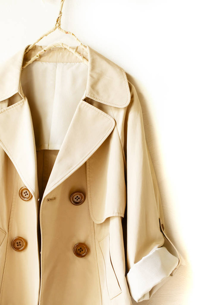 Beige elegant trench coat isolated over white - Foto, immagini