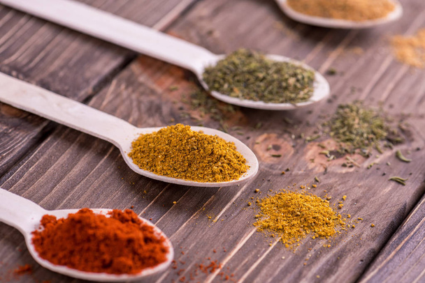 Set spices in measuring spoon. Cooking and seasoning for taste. - Фото, зображення