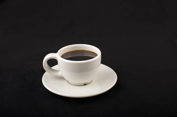 White cup of black coffee in the dark - Foto, Imagem