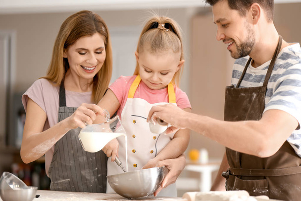 Happy family preparing dough - Photo, image