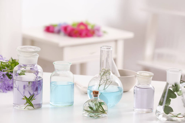 Bottles with different perfume oils  - Foto, Bild