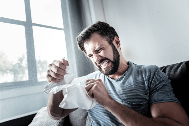 Hysteric emotional man tearing up paper - Fotografie, Obrázek