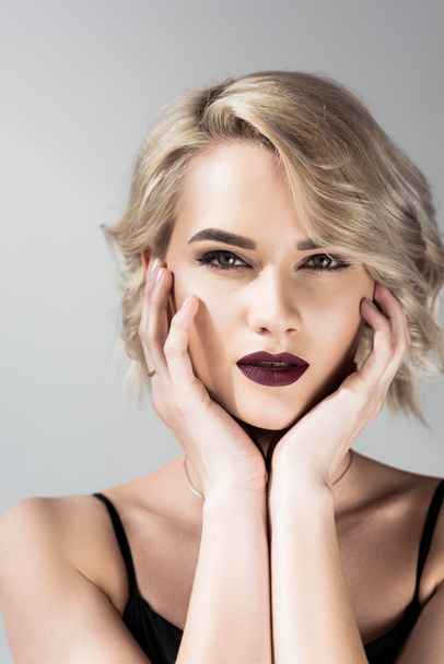 portrait of attractive blonde girl with makeup, isolated on grey  - Photo, Image