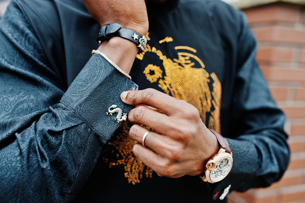 Close up hands of rich african man with watch and cufflinks. - Foto, imagen