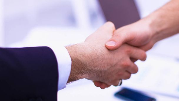 Businessmen shaking hands, isolated on white.  - Foto, Bild