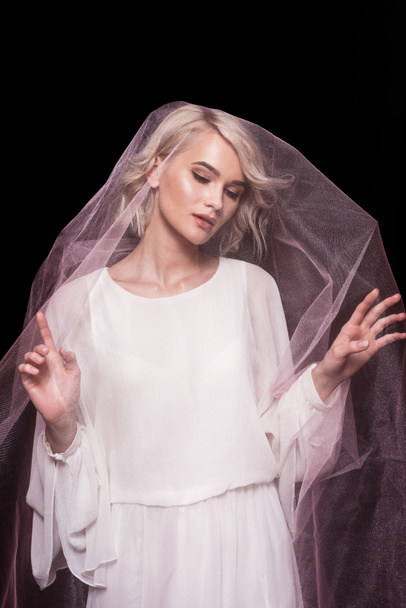 blonde girl posing in pink veil, isolated on black - Фото, изображение