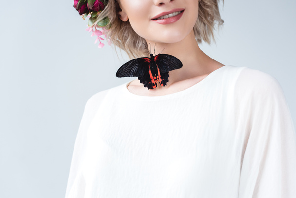 cropped view of happy girl with beautiful alive butterfly on neck, isolated on grey - Photo, Image