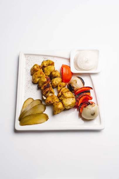 Chicken barbeque with grilled vegetables and mayonaise served on white plate - Fotografie, Obrázek