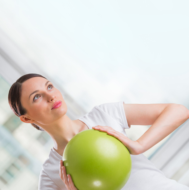 Portrait of fit and healthy gym woman with ball at fitness club - Fotoğraf, Görsel