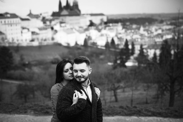 Happy young couple in love in Prague city - 写真・画像