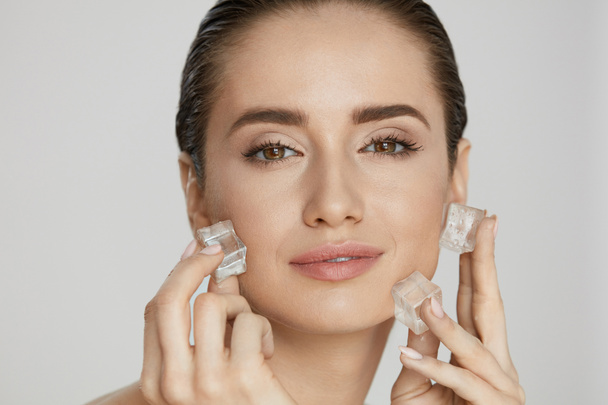 Ice On Skin. Woman Doing Face Skin Treatment - Zdjęcie, obraz