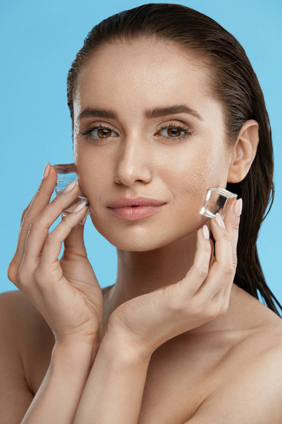 Face Skin Care. Woman Applying Ice Cubes - Фото, зображення