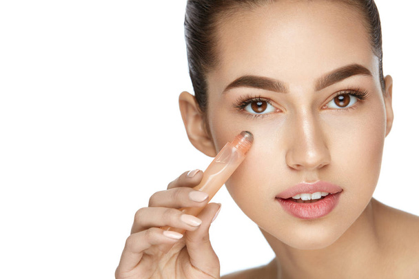 Eye Skin Care. Beautiful Woman Using Cream - Photo, image