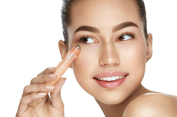 Eye Skin Care. Beautiful Woman Using Cream - Photo, Image