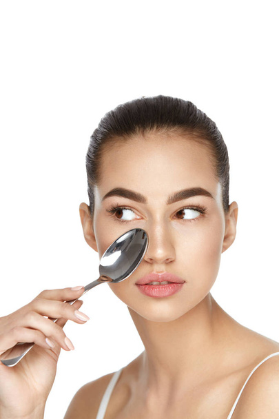 Beauty. Woman With Cold Spoon Near Eye - Photo, Image