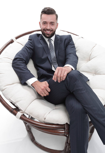 successful businessman sitting in a chair. - Foto, imagen