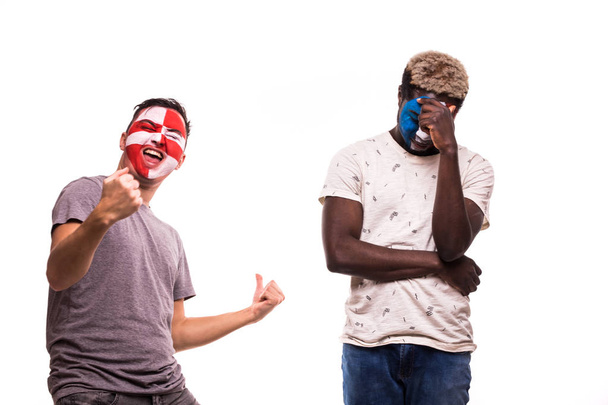 Happy Football fan of Croatia celebrate win over upset football fan of France with painted face isolated on white background - Φωτογραφία, εικόνα