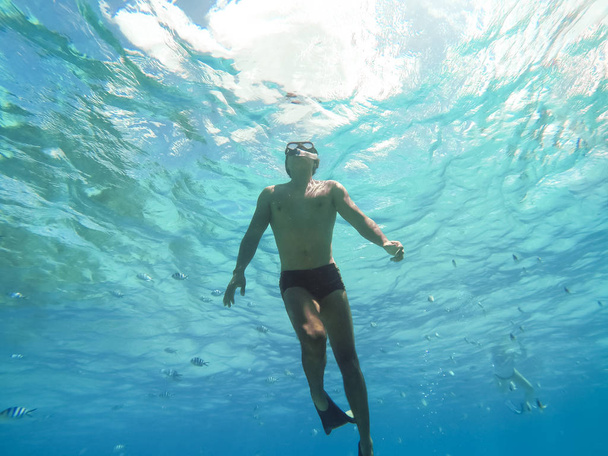 Bora Bora, French Polynesia. Snorkeling in turquoise waters. - Photo, Image