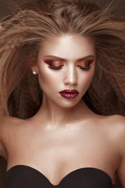 Beautiful blond model: curls, bright makeup and red lips. The beauty face. - Foto, Imagen
