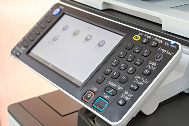 Cierre del panel de control de la impresora o fotocopiadora
 - Foto, Imagen