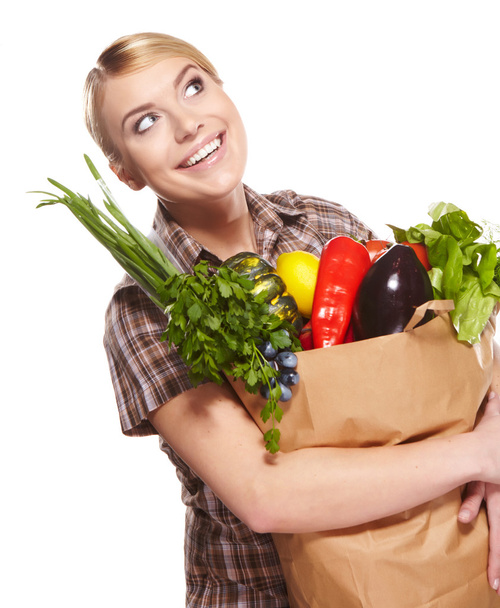 woman holding a shopping bag full of groceries, mango, salad, r - Fotoğraf, Görsel