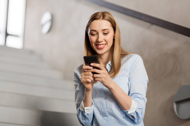woman or student with smartphone at office stairs - Фото, зображення