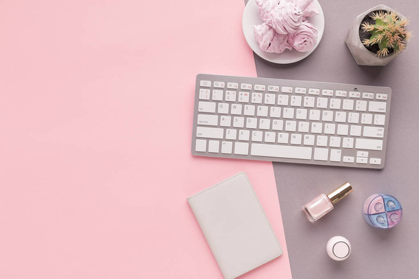 Working space with keyboard on pink background - Photo, Image