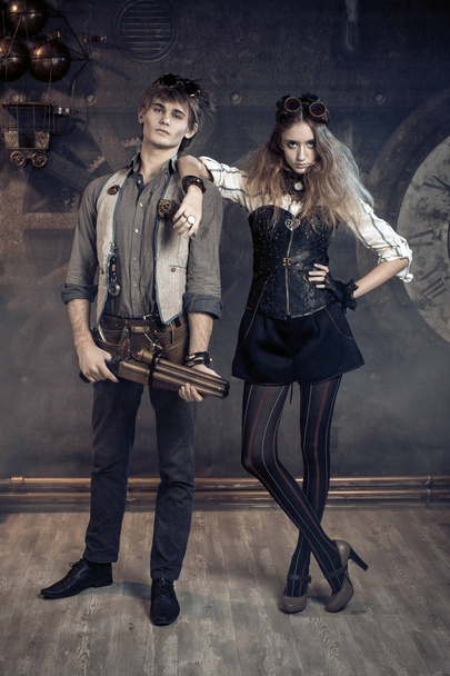 Portrait of a young beautiful loving couple in steampunk style.  - Foto, Bild