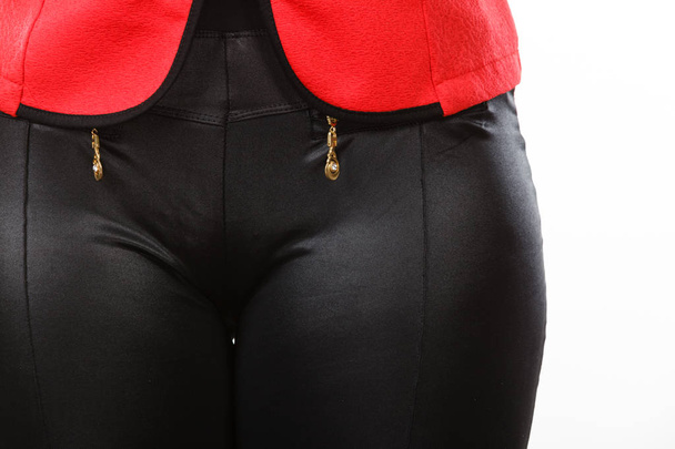 Closeup of woman pants made of synthetic material - Fotó, kép