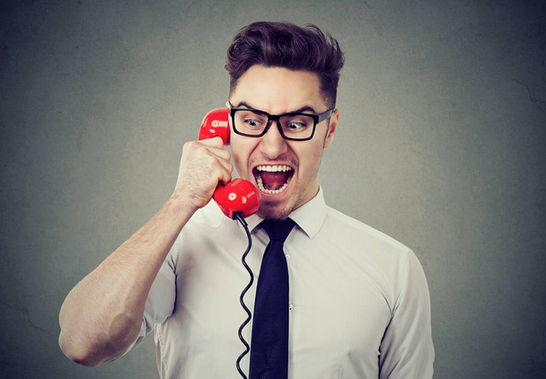 Angry mad businessman screaming on the phone  - Photo, Image