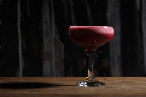 Raspberry cocktail on wooden table. Close up - 写真・画像