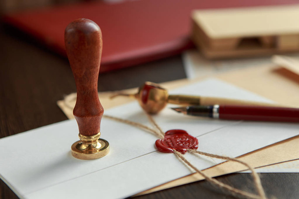 Old parchment or diploma scroll with wax seal and quill pen - Foto, Imagem
