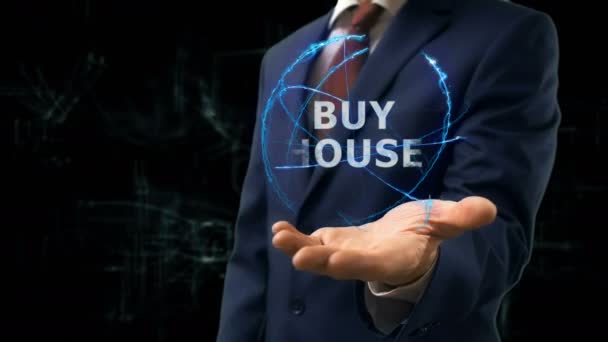Homme d'affaires montre concept hologramme Acheter maison sur sa main
 - Séquence, vidéo