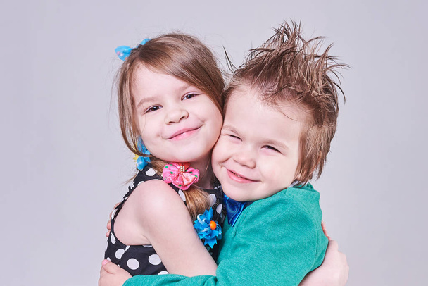 Beautiful little boy and girl cute hugging - Photo, Image