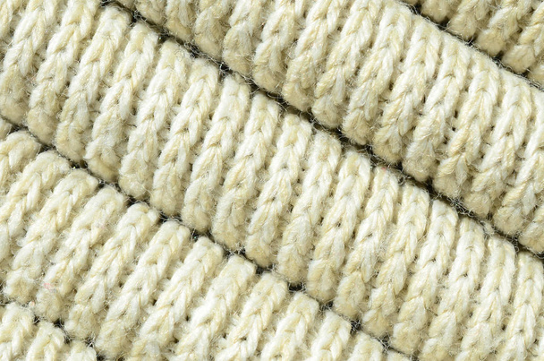 Composition d'un pull tricoté jaune doux. Macro texture des liants dans les fils
 - Photo, image