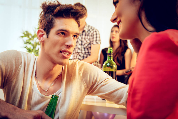 Young woman looking at girlfriend on party - Photo, image