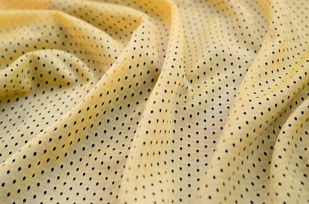 Tissu de tissu de maillot de sport jaune texture et fond avec de nombreux plis
 - Photo, image