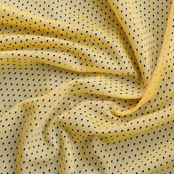 Keltainen urheilu jersey vaatteet kangas rakenne ja tausta monia taittuu
 - Valokuva, kuva