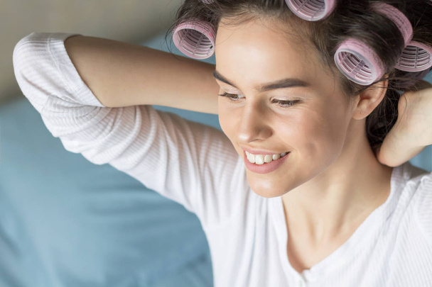 Modern Sweet Woman in Hair Curlers. Home Concept - Foto, Imagem
