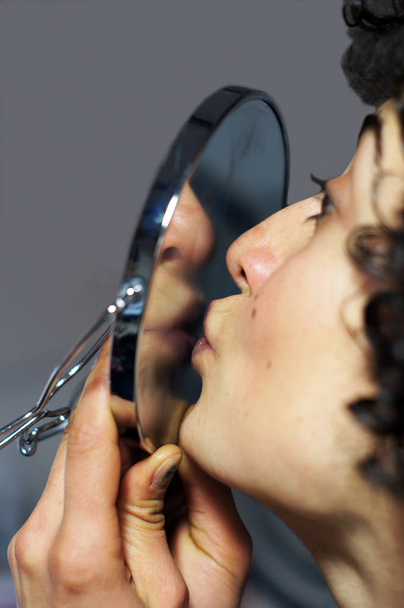 Woman is kissing herself on mirror - Valokuva, kuva